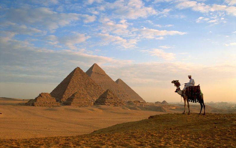 a-camel-rider-overlooking-the-pyramids-from-a-steep-hill-at-giza 4 Day Cairo Tour
